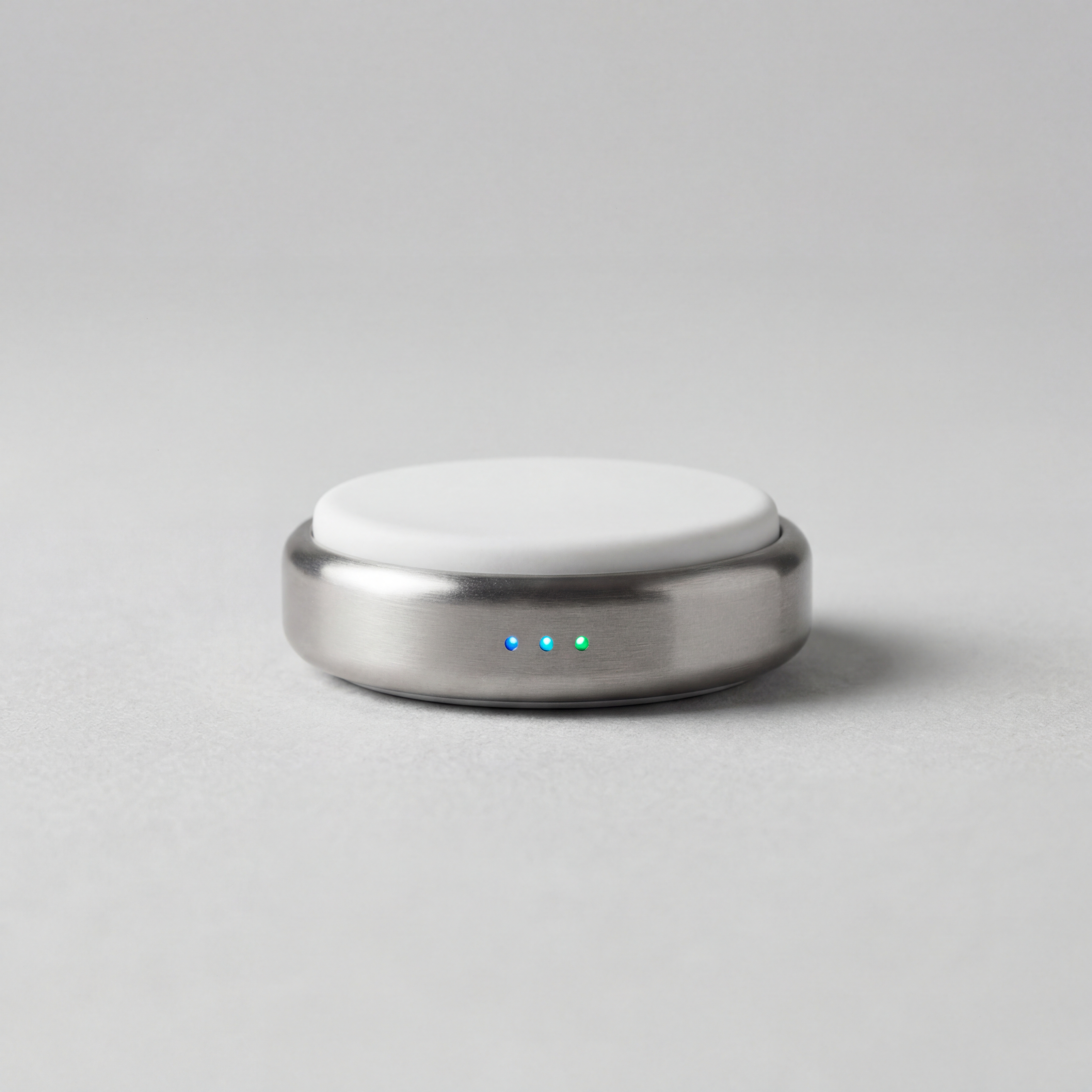 Wearable health sensor device designed for continuous dermatological monitoring displayed on a neutral surface