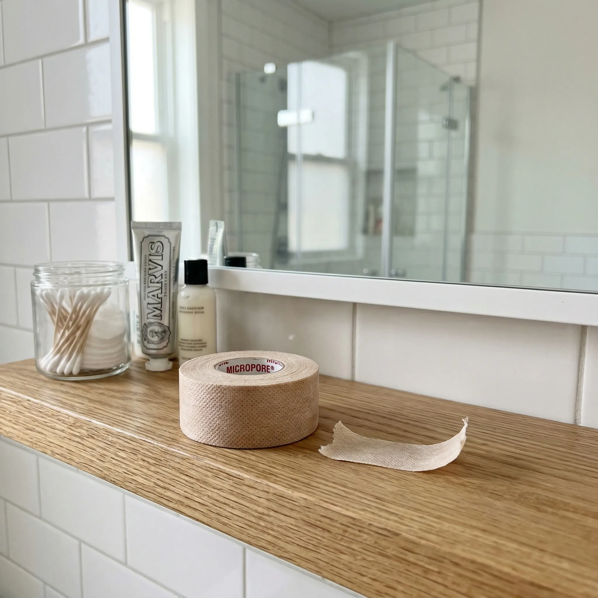 Step-by-step illustration showing proper placement of medical tape across the lips for sleep